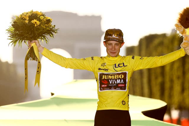 <p>Jumbo-Visma’s Jonas Vingegaard celebrates on the podium </p>