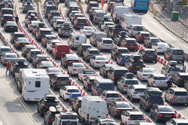 <p>Cars queue at the check-in at the Port of Dover in Kent as many families embark on getaways following the start of summer holidays</p>