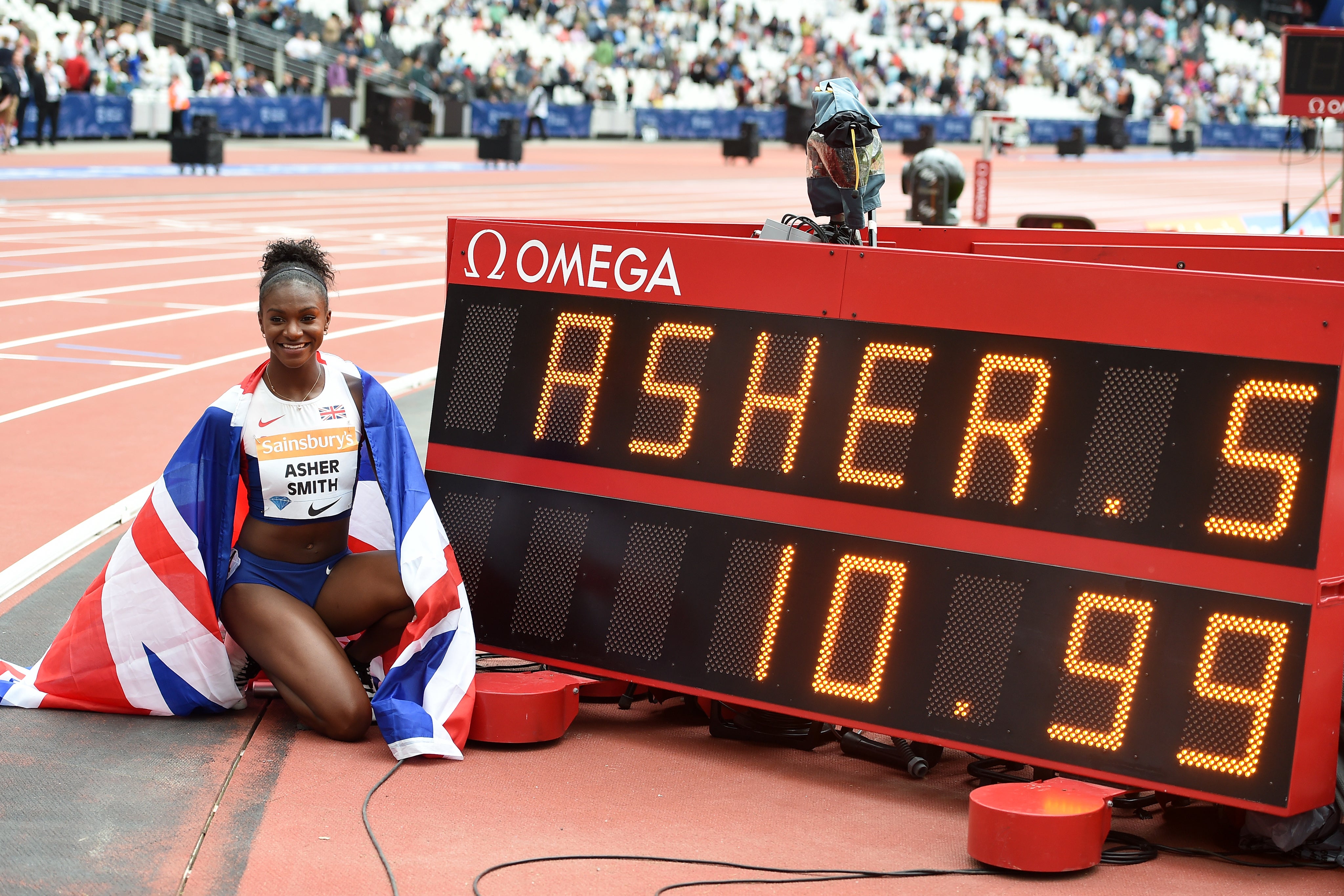 Dina Asher-Smith celebrates becoming the first British woman to run the 100 metres in under 11 seconds (Martin Rickett/PA)