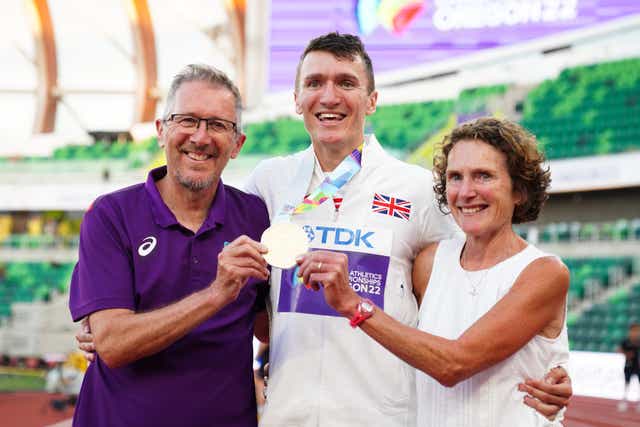 Great Britain’s Jake Wightman celebrates with dad Geoff and Susan (Martin Rickett/PA)