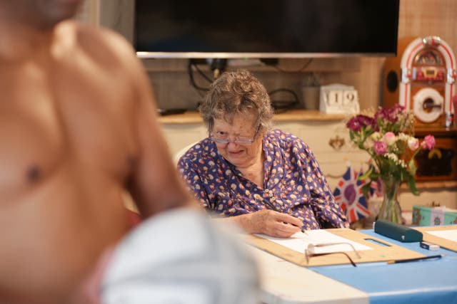 Resident Rosemary Lester gets a look at the nude model during Sherwood Grange’s life drawing session (Andrew Williams/Care UK)
