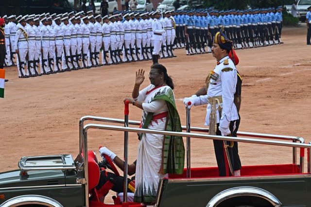 <p>India's new president Droupadi Murmu inspects a guard of honour after her swearing-in ceremony at presidential palace Rashtrapati Bhavan </p>