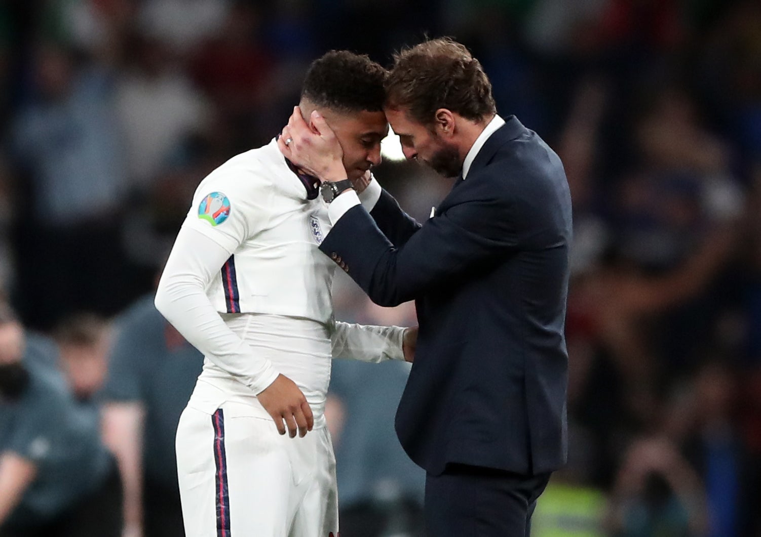 England manager Gareth Southgate consoles Sancho during the final