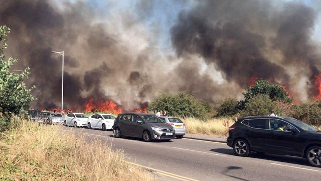 <p>Grass fires at Wanstead Flats in northeast London  during the heatwave caused heavy smoke throughout the area </p>