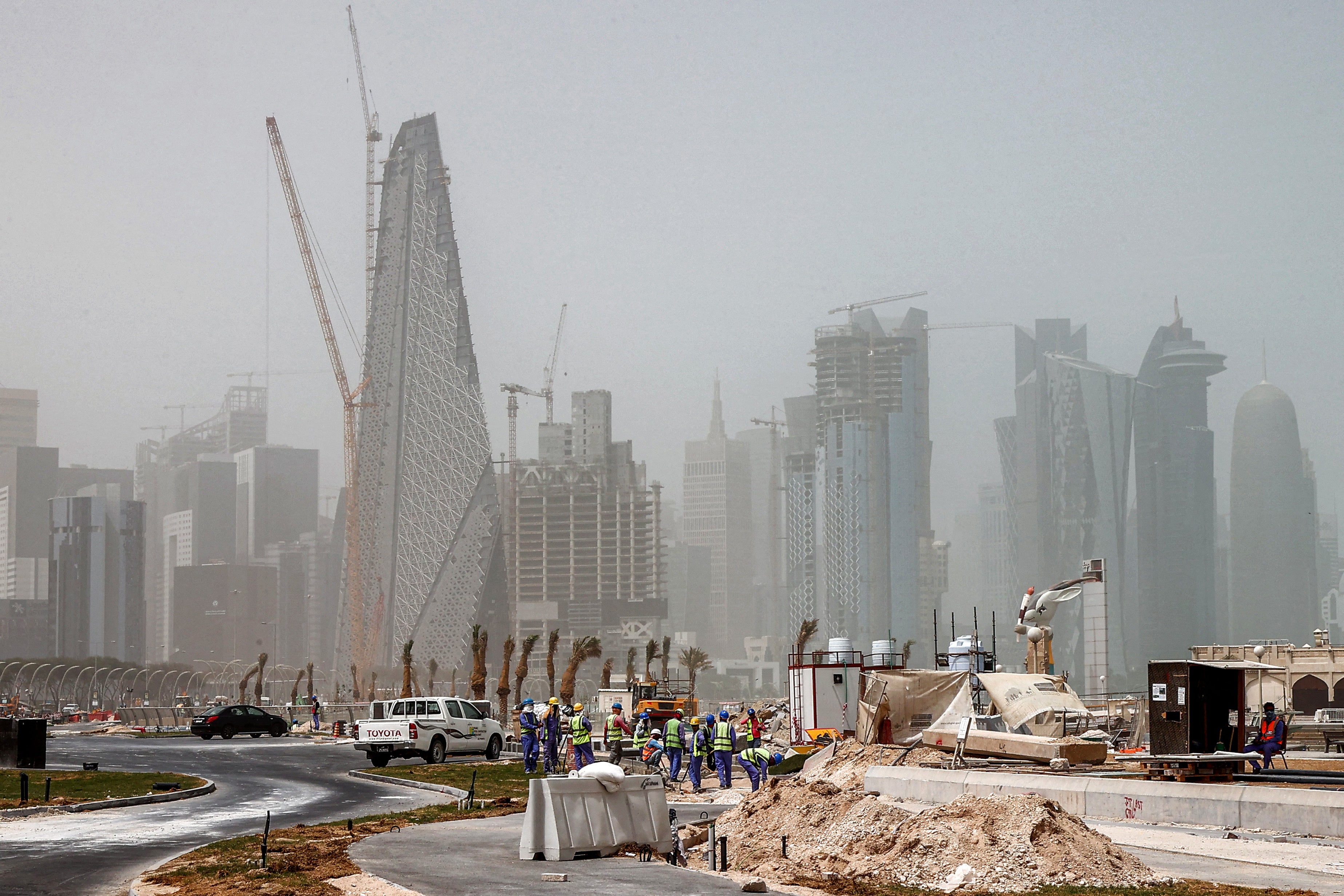 <p>Construction workers in central Doha</p>