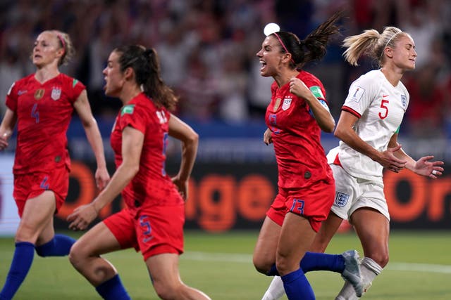 United States players celebrate as Steph Houghton, right, reacts to her penalty being saved in the 2019 World Cup semi-final (John Walton/PA)