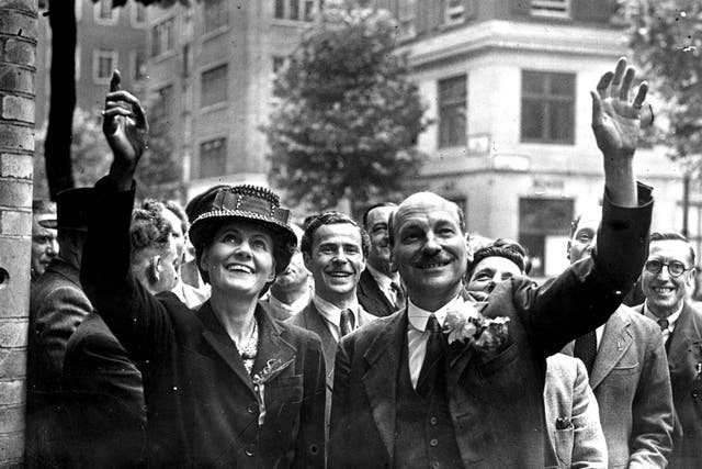 <p>Clement Attlee and his wife Violet wave to crowds in London on 26 July 1945 – the day he became prime minister </p>