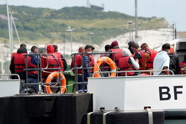 A group of people thought to be migrants are brought in to Dover, Kent, following a small boat incident in the Channel (Gareth Fuller/PA)