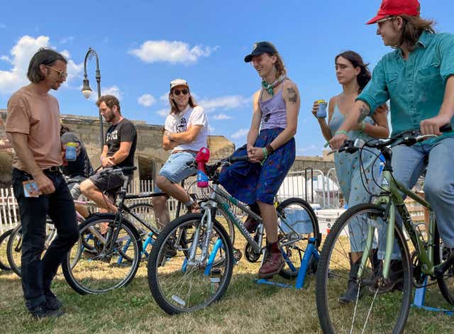 <p>Concertgoers sit on stationary bikes used to power a small stage at the Newport Musical Festival in Rhode Island this past weekend </p>