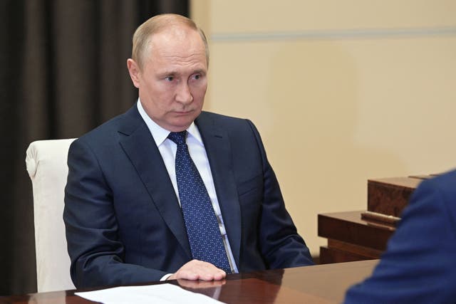 <p>Russian president Vladimir Putin meeting with Energy Minister at the Novo-Ogaryovo residence, outside Moscow on 21 July</p>