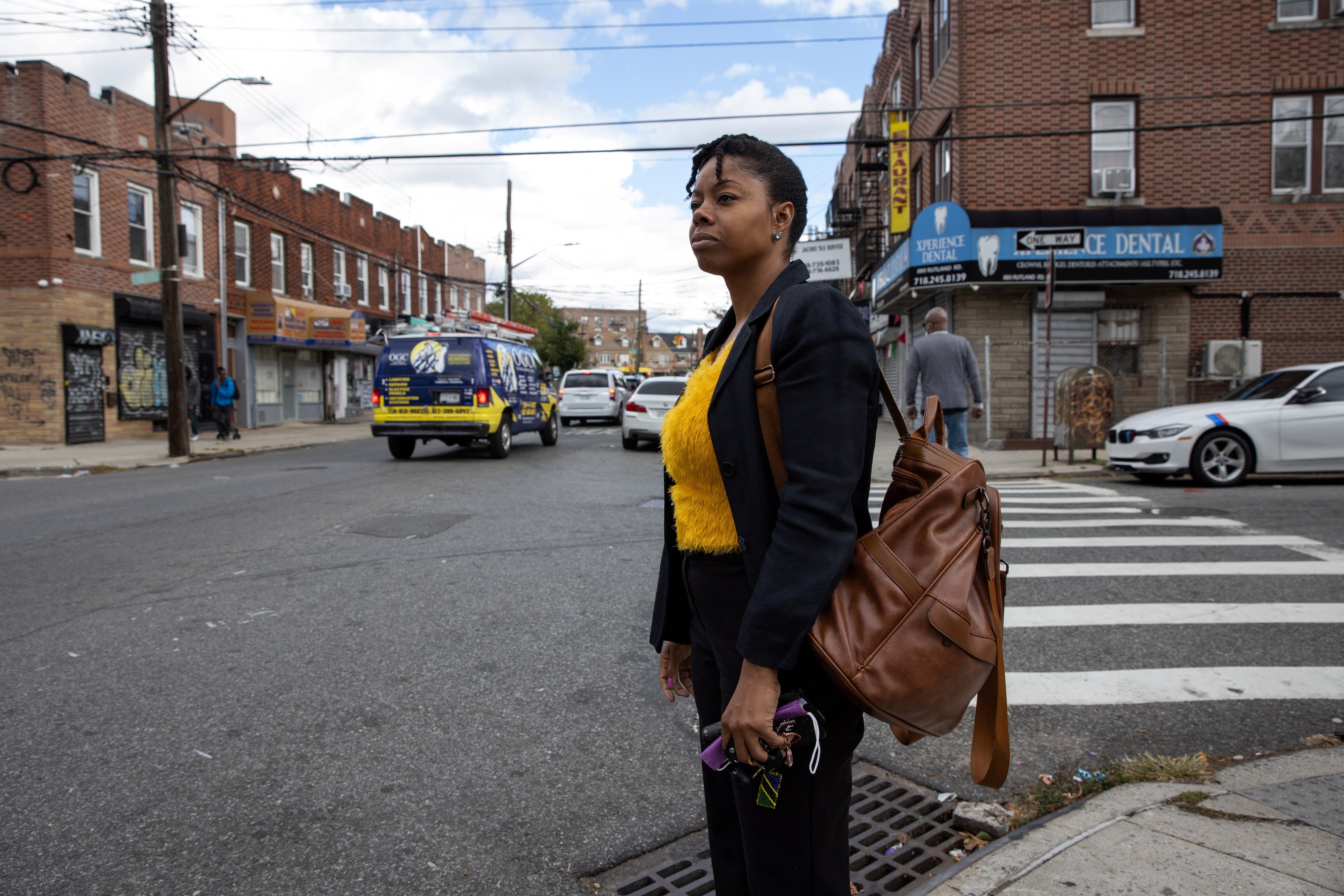 Nicole Sharpe waits to cross the street in New York