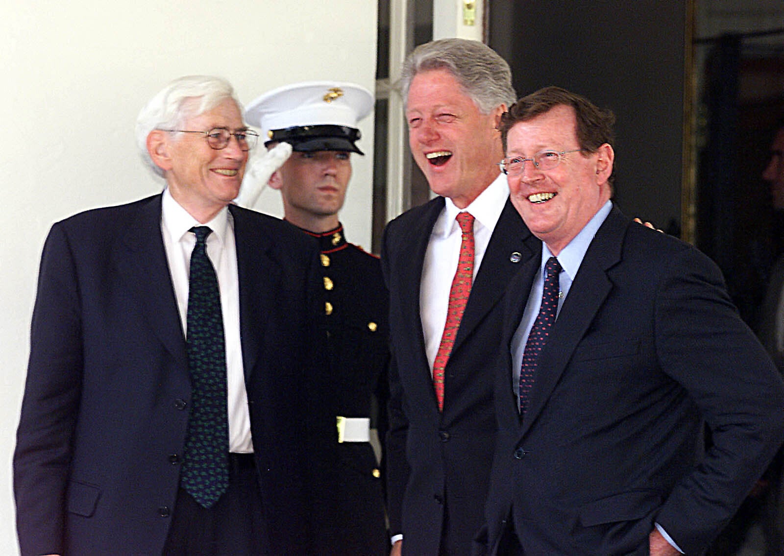 Former US President Bill Clinton, second from right, jokes with Seamus Mallon and David Trimble when they visited the White House in Washington (Paul Faith/PA)