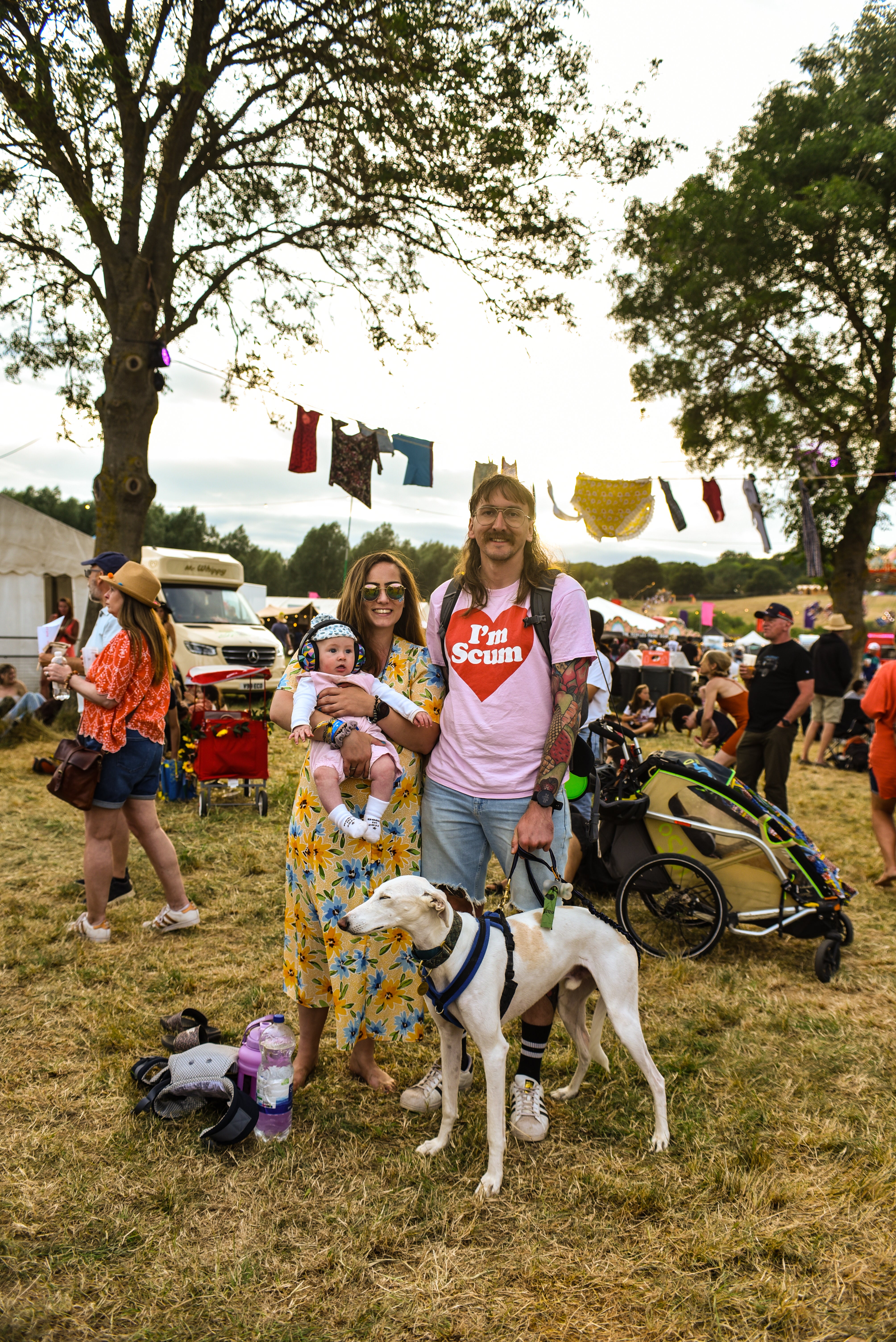 A young family and their dog enjoying the music at Laundry Meadows