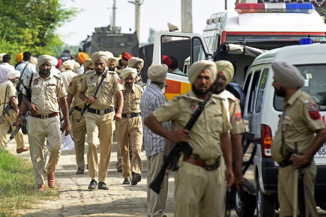 <p>Representational image: Punjab police personnel stand guard</p>