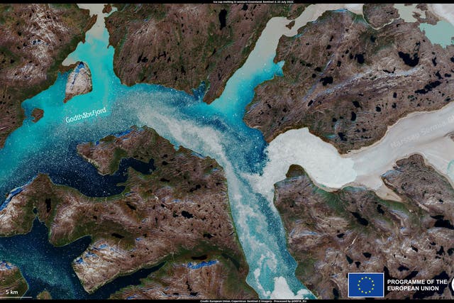 <p>Sediment pours into a fjord in Greenland after extended heat melts the island’s ice sheet</p>