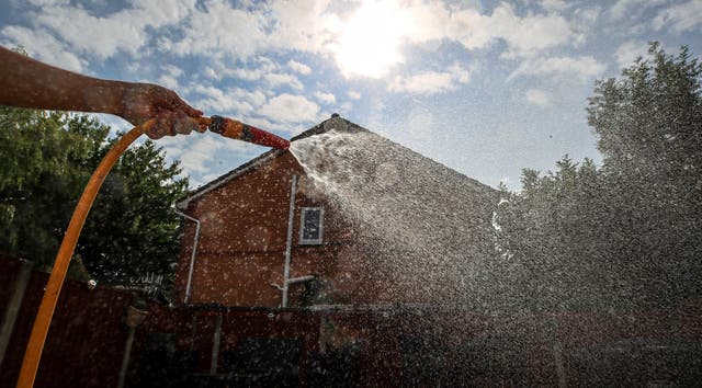 Hosepipe attached to a water tap. People are being urged to use water wisely as England faces drought in August (Peter Byrne/PA)