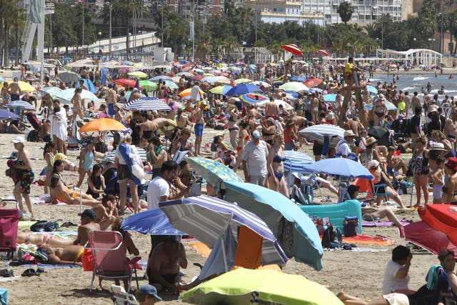 <p>A crowded beach in the coastal city of Alicante, eastern Spain</p>