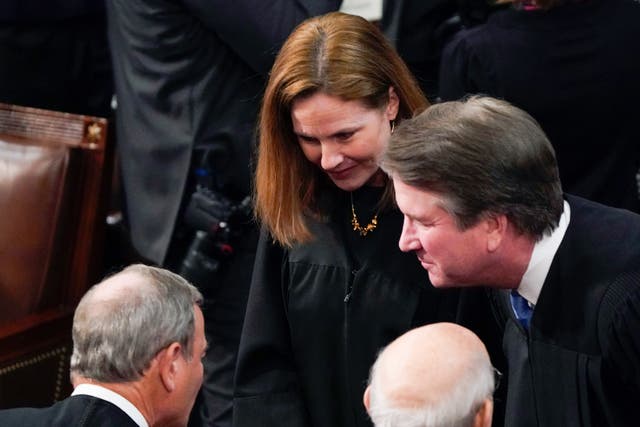 <p>Supreme Court Justices Amy Coney Barrett, Brett Kavanaugh, and Stephen Breyer talk with Chief Justice of the United States John Roberts, left, before President Joe Biden delivers his first State of the Union address</p>