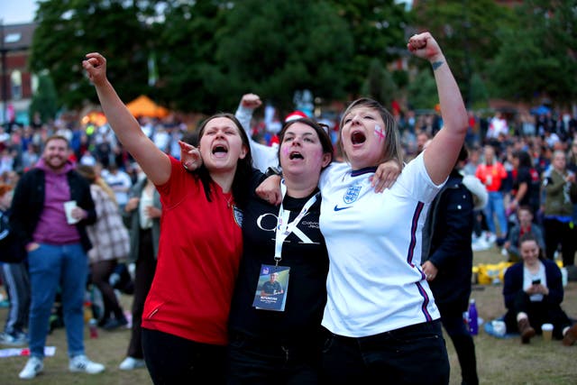 <p>Game faces: England fans celebrate at Sheffield’s Devonshire Green </p>
