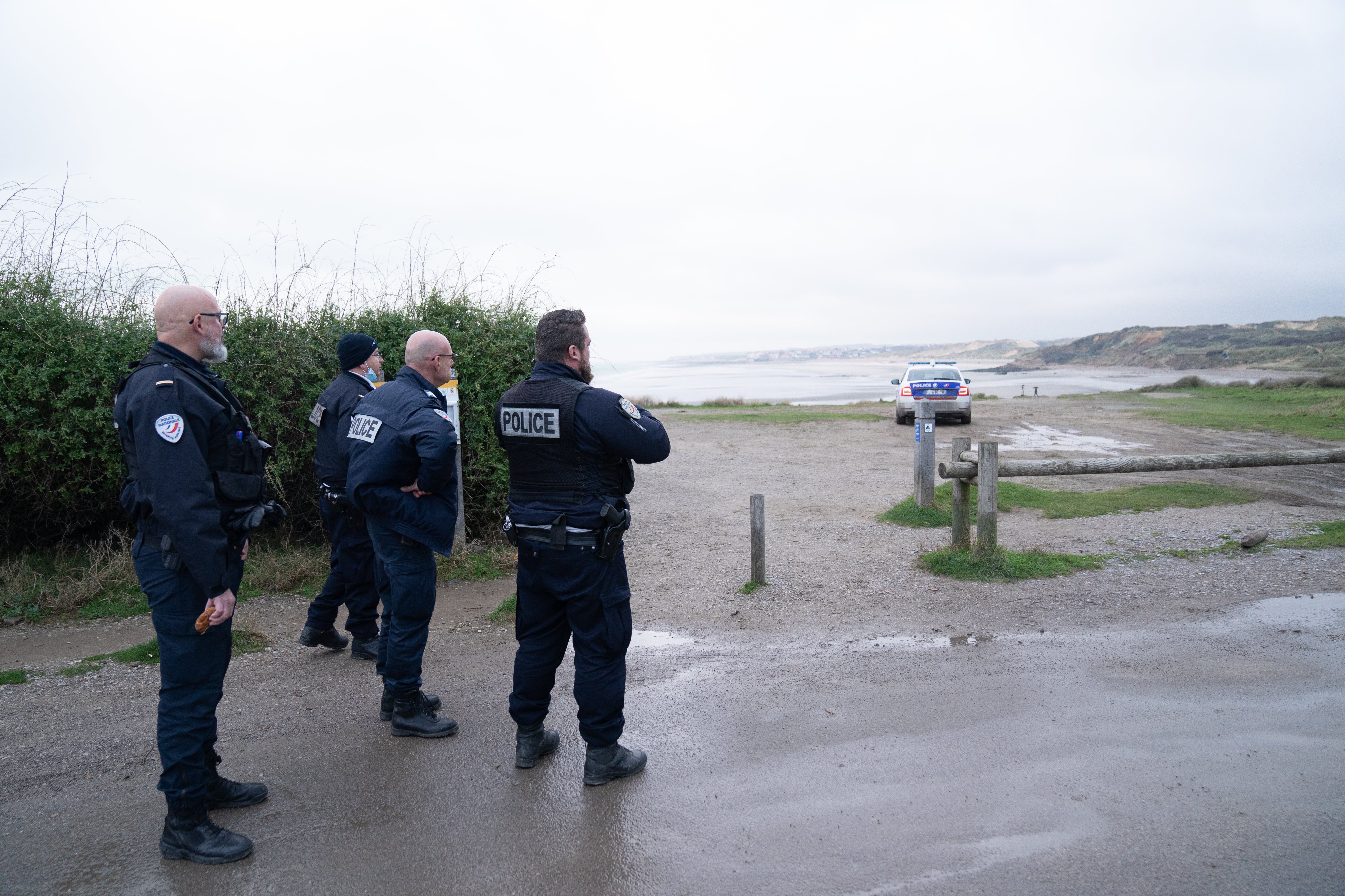 French police look out over a beach near Wimereux in France believed to be used by migrants trying to get to the UK after the November tragedy