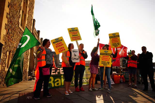 Members of the Rail, Maritime and Transport union on the picket line outside Bristol Temple Meads station (Ben Birchall/PA)