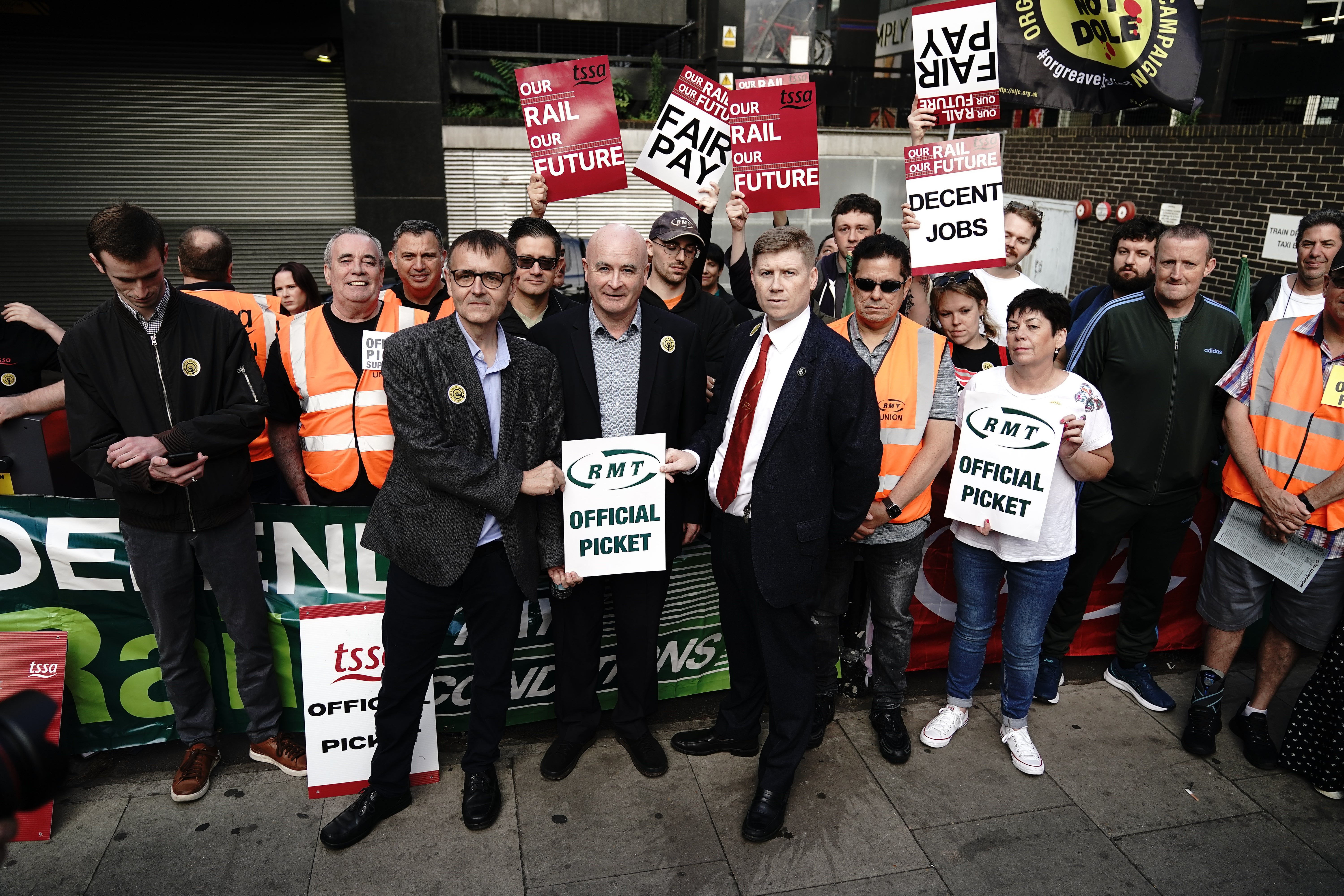 RMT general secretary Mick Lynch (centre) and assistant general secretary Eddie Dempsey (right) outside London Euston station (Aaron Chown/PA)