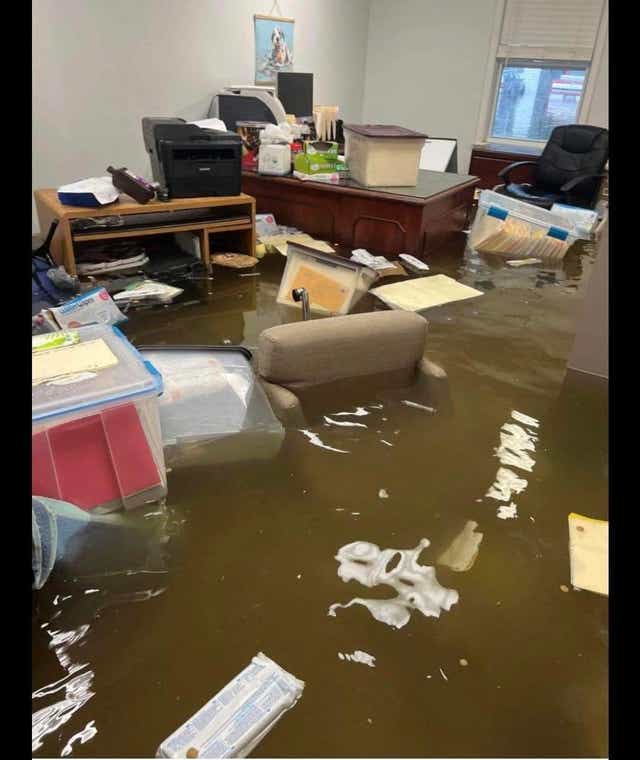 <p>The inside of Stray Paws Adoptables, a St Louis-area rescue facility for animals, is seen flooded after record-breaking rainfall fell in the Missouri city on Tuesday</p>