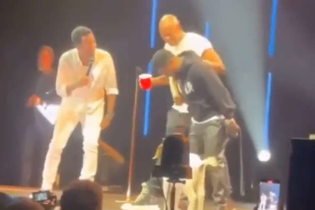 <p>Kevin Hart gives Chris Rock a goat on stage</p>
