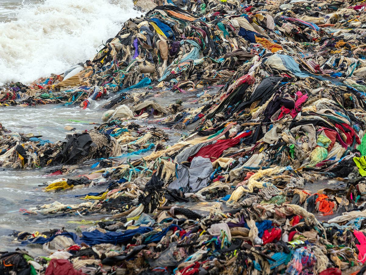 Mountains of clothes washed up on Ghana beach show cost of fast fashion