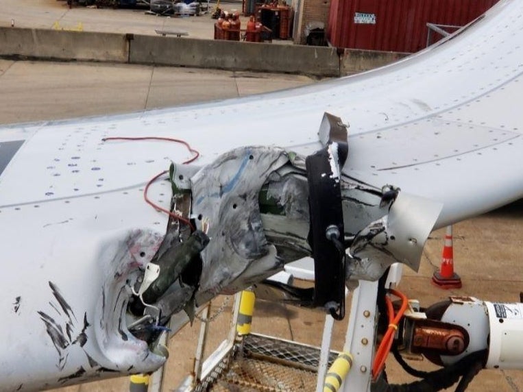 The damaged wing of the American Airlines Airbus A321 aircraft