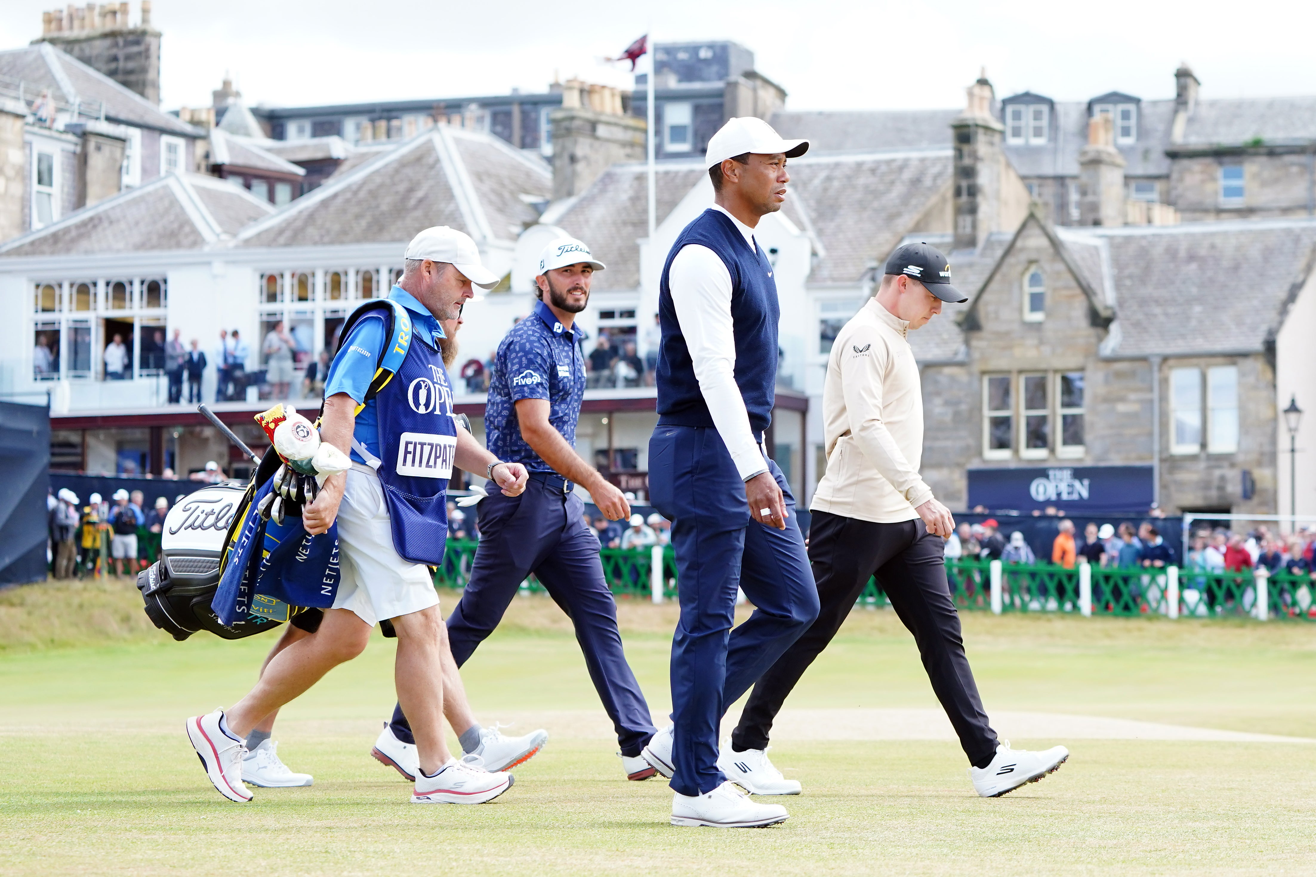 Tiger Woods, Max Homa and Matt Fitzpatrick make their way down the 1st fairway during day one of The Open at St Andrews (Jane Barlow/PA)