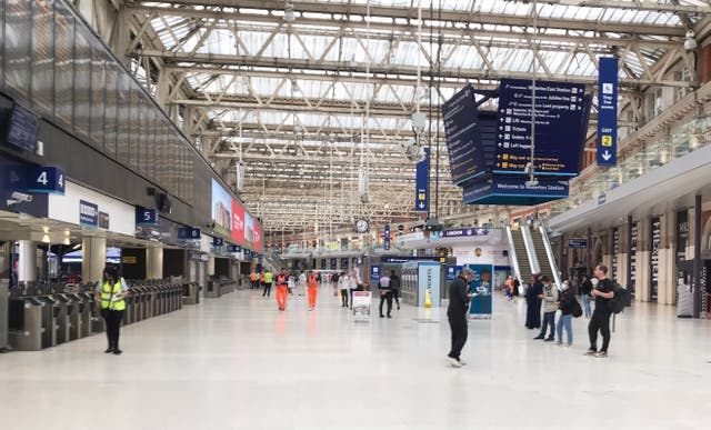 Passengers at Waterloo train station as union members take part in a fresh strike over jobs, pay and conditions (Andrew Quinn/PA)