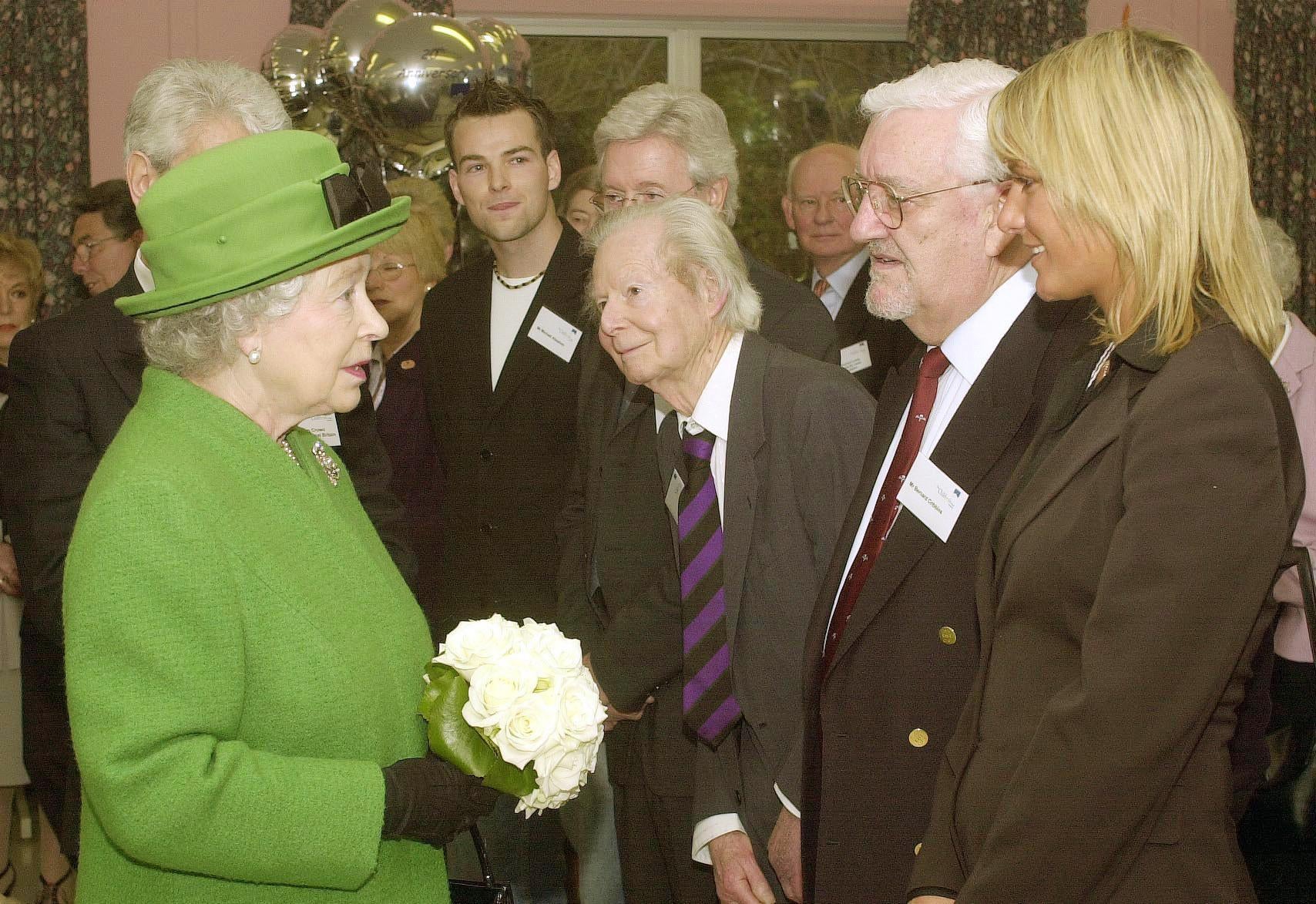 Meeting the Queen at Children’s Trust in Tadworth, Surrey in 2004 (John Stilwell/PA)