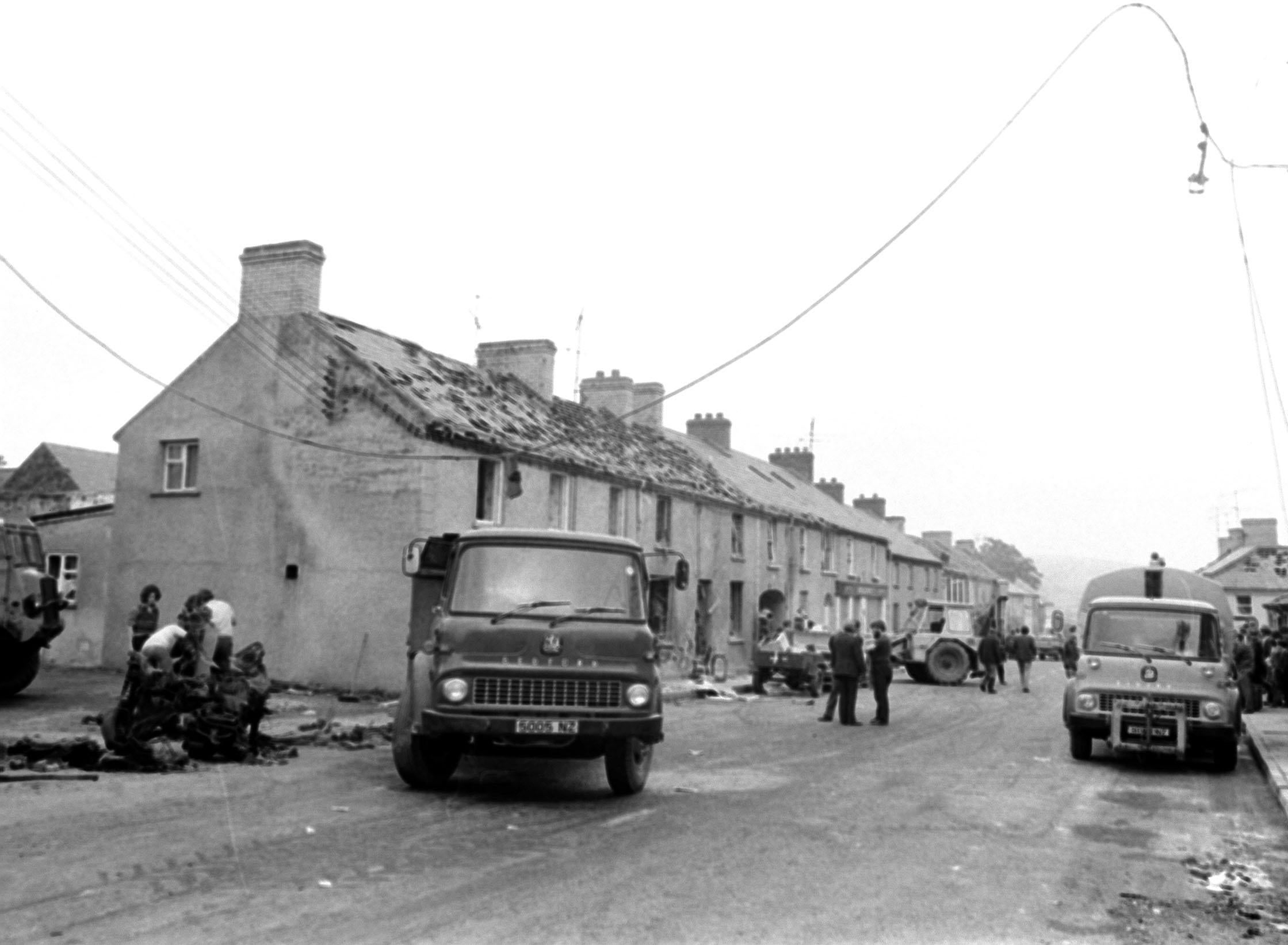 The clean up in the Co Londonderry village of Claudy on July 31, 1972, after three car bombs exploded killing nine people (PA)