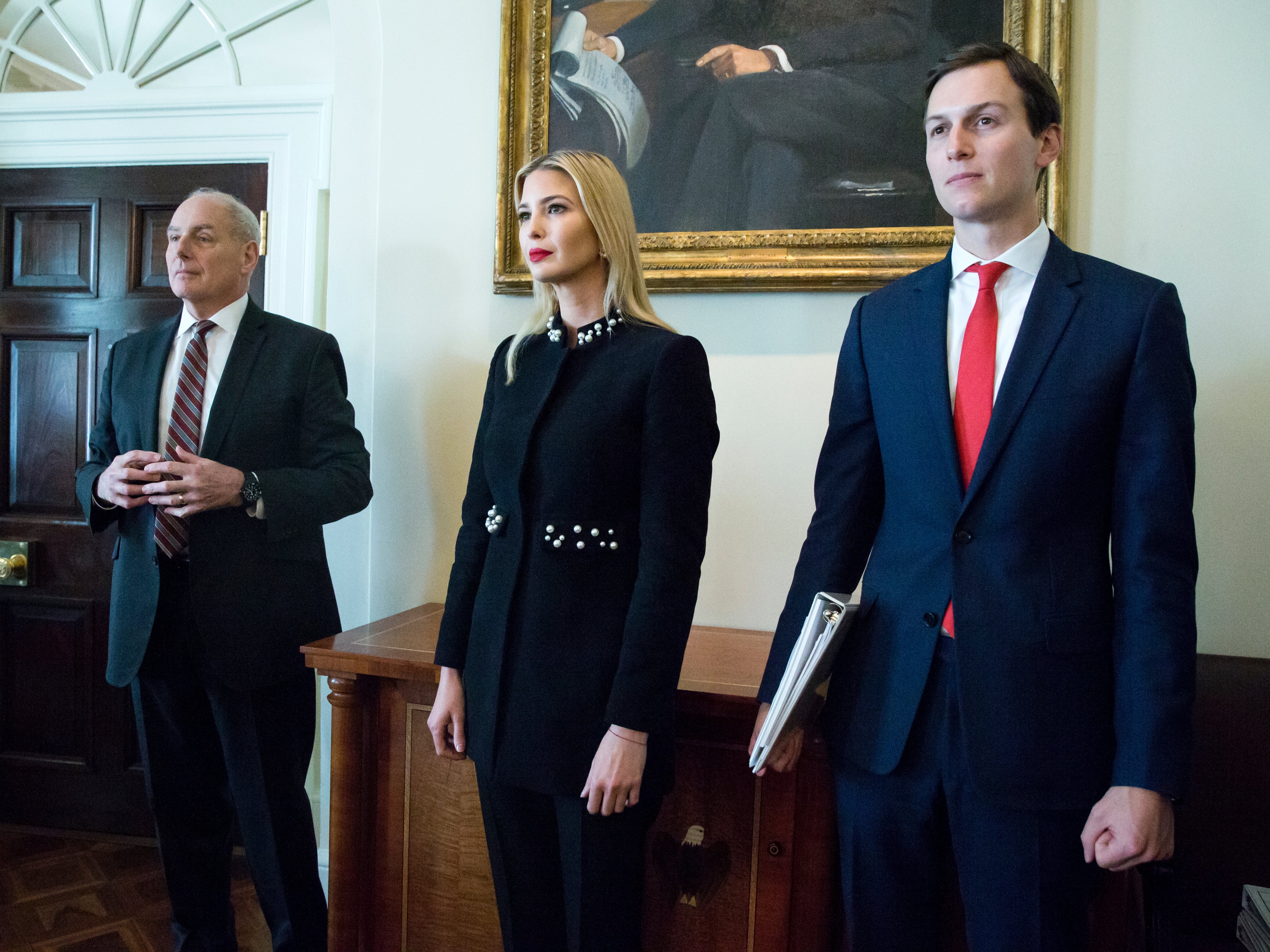 White House Senior Advisor Jared Kushner (R), First daughter Ivanka Trump (C) and White House Chief of Staff John Kelly (L) attend a meeting held by US President Donald J. Trump