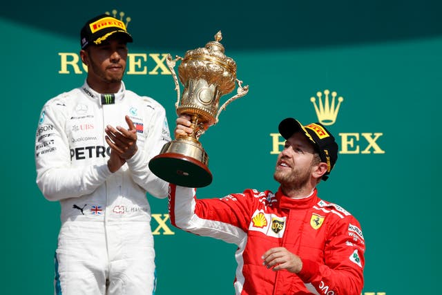 Lewis Hamilton, left, has paid tribute to the retiring Sebastian Vettel (Martin Rickett/PA)