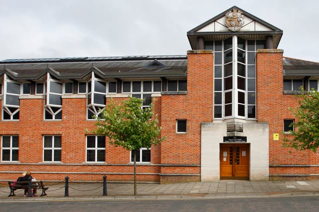 Two men and a woman are now on trial at Newport Crown Court charged with modern slavery offences (PA)
