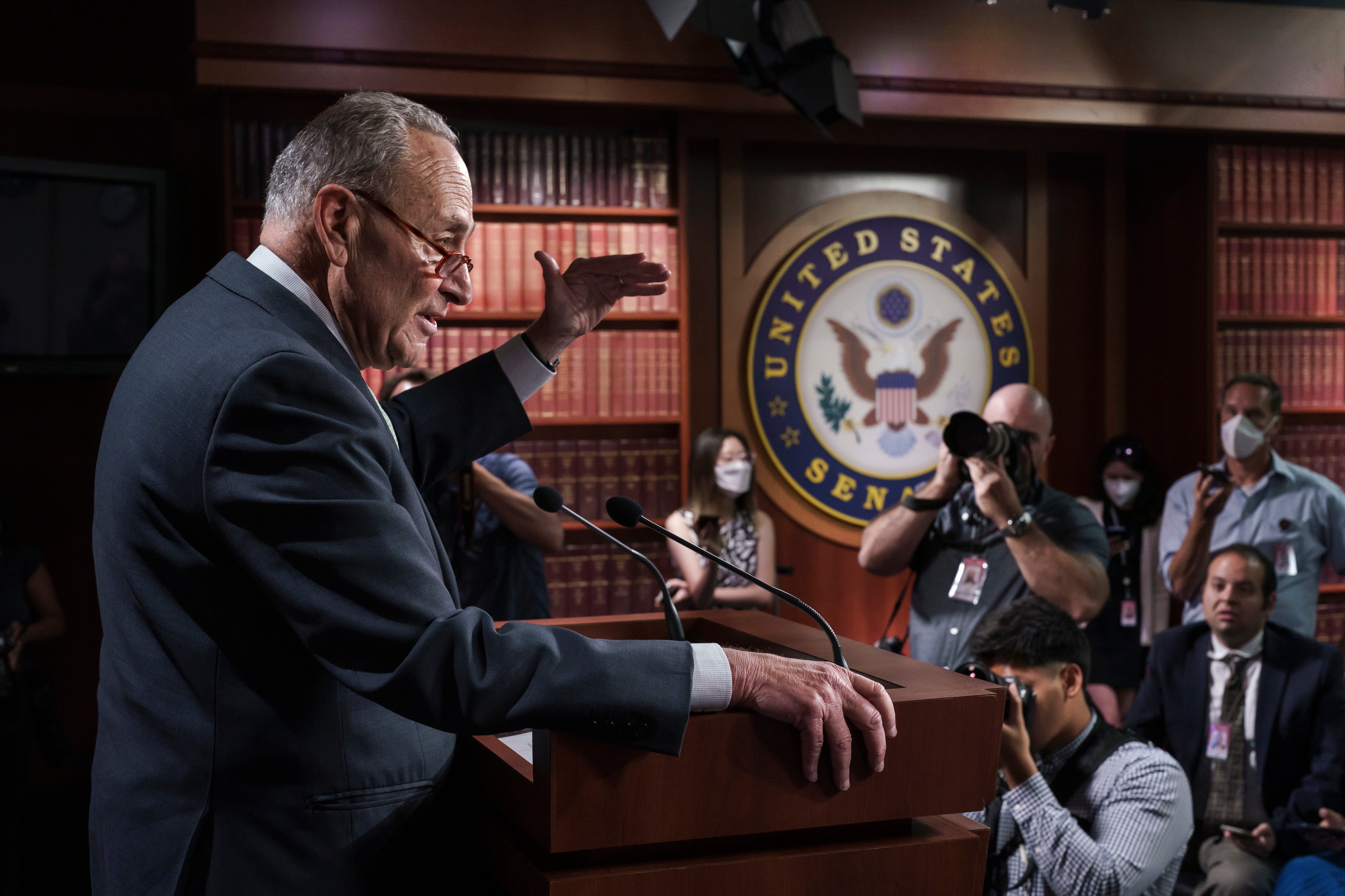 Chuck Schumer talks to reporters about the deal reached with Joe Manchin