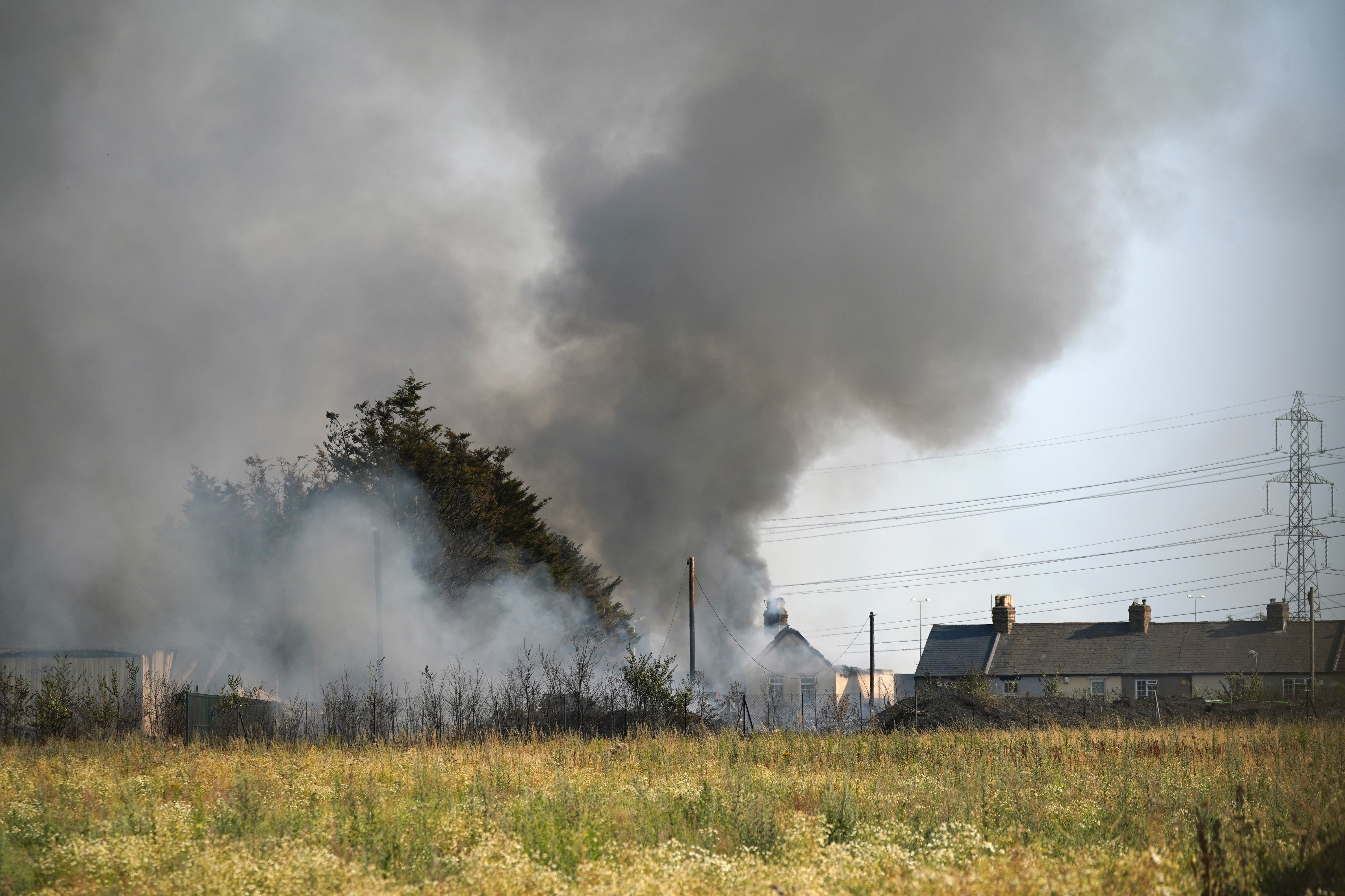 The scene of a blaze in the village of Wennington, sparked by the heatwave (Yui Mok/PA)