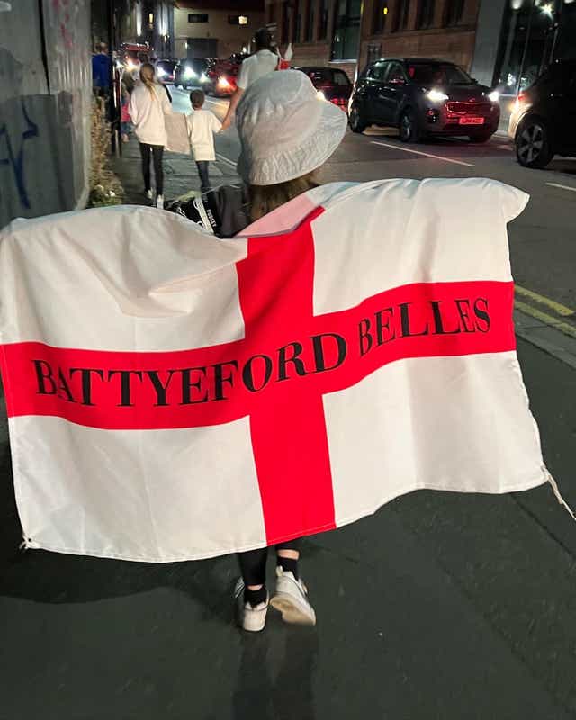 Lauren holding the Battyeford Belles flag (Kerry Laville)