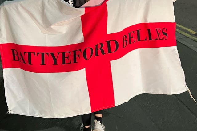 Lauren holding the Battyeford Belles flag (Kerry Laville)