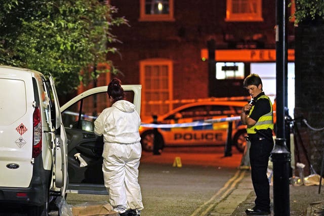 <p>Police at the scene in Boston after a nine-year-old girl died from a suspected stab wound</p>