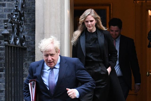 <p>Boris Johnson and Cleo Watson leave Downing Street in October 2020 </p>
