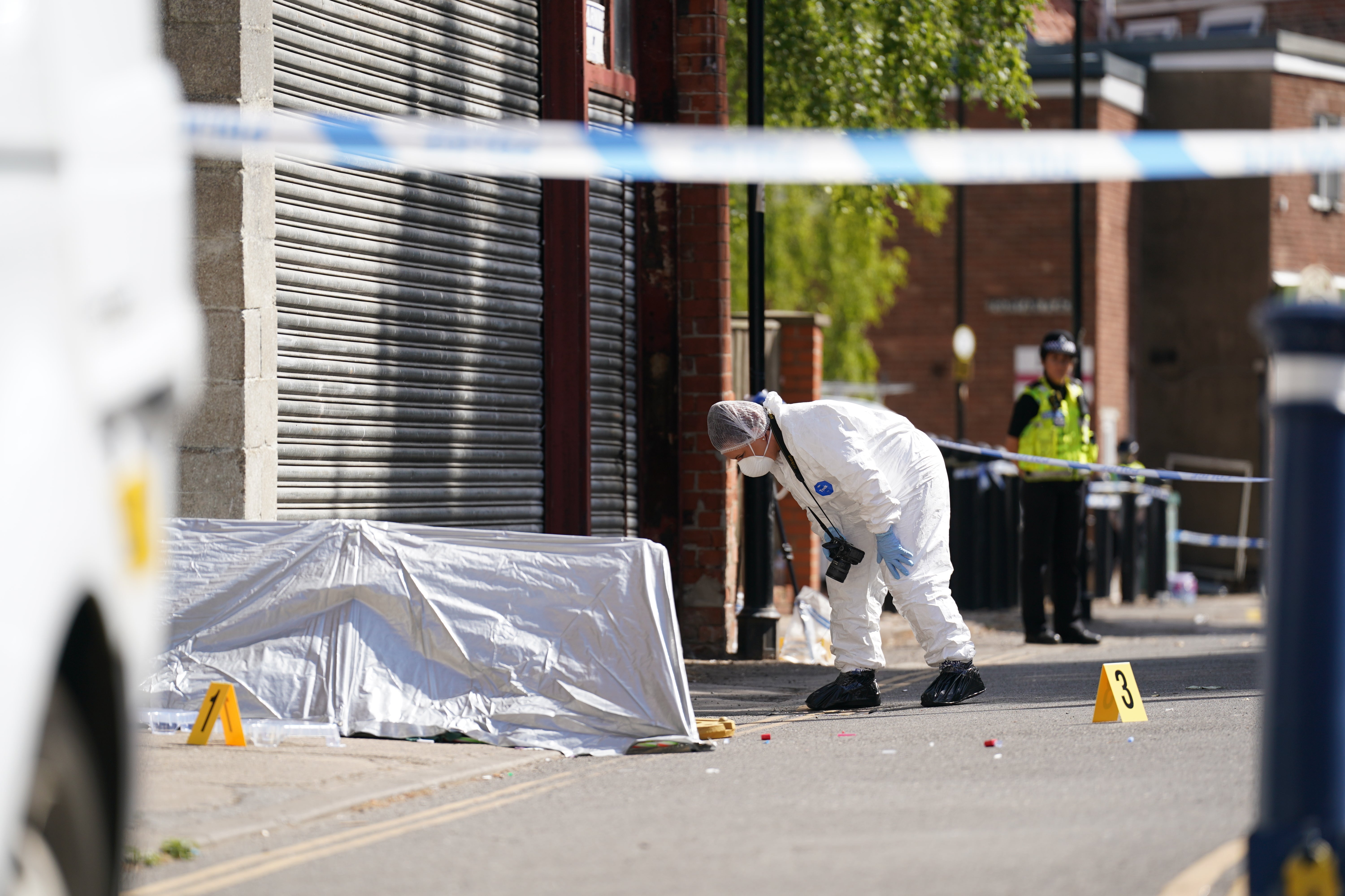 A forensic officer near the scene