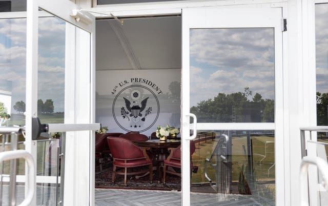 <p>A viewing room in a tent at the 18th green with the US Presidential Seal at the LIV Golf Bedminster</p>