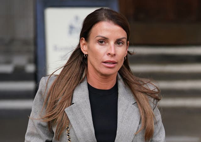 <p>Coleen Rooney leaving the Royal Courts Of Justice, London, during the libel battle </p>