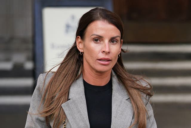 <p>Coleen Rooney leaving the Royal Courts Of Justice, London, during the libel battle </p>