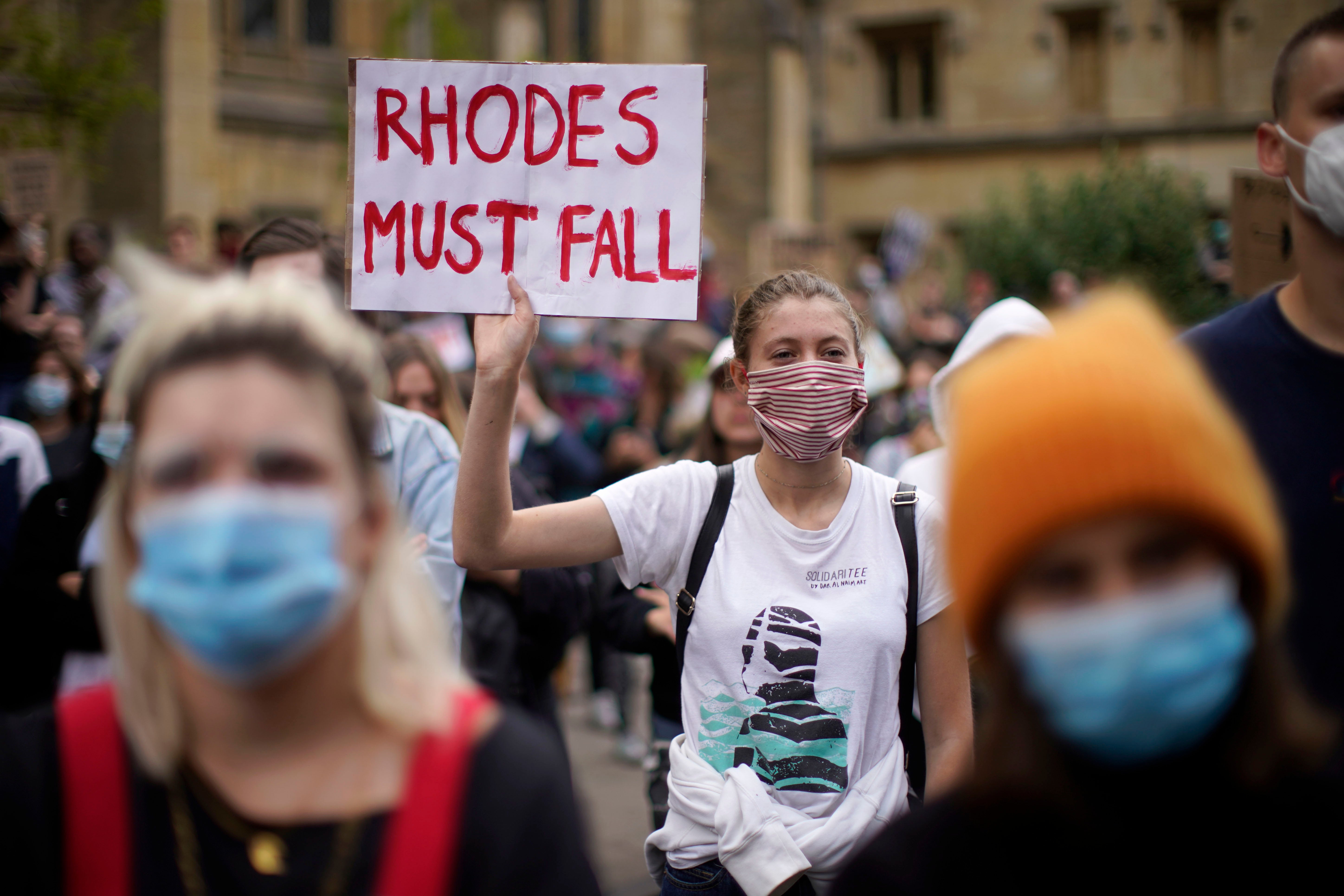 A ‘Rhodes Must Fall’ protester outside Oriel College