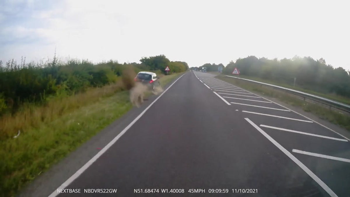 Car crashes and flips over in ditch after attempting to overtake carelessly-driven lorry