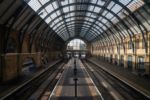Empty tracks in King’s Cross train station in London (Aaron Chown/PA)